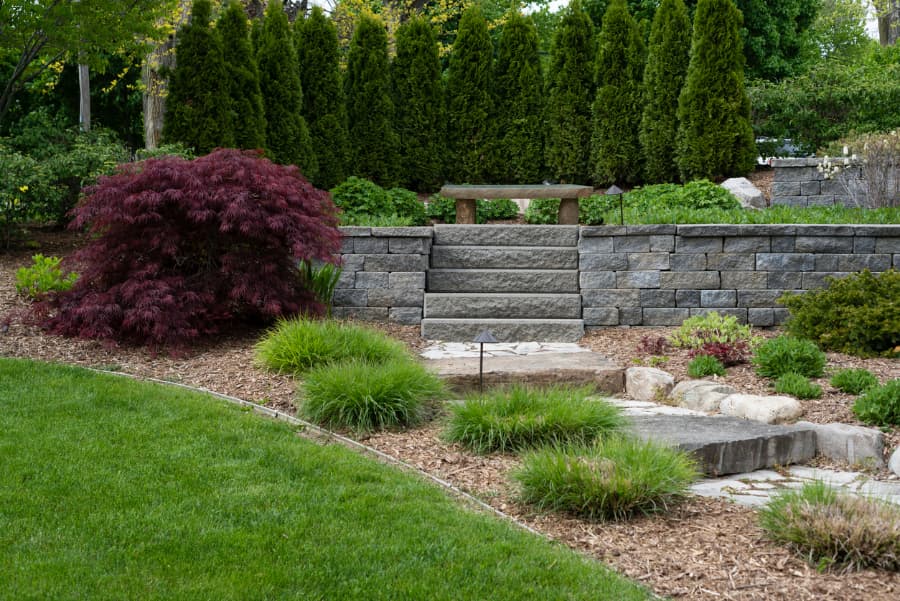 Home hardscape with pavers and boulders