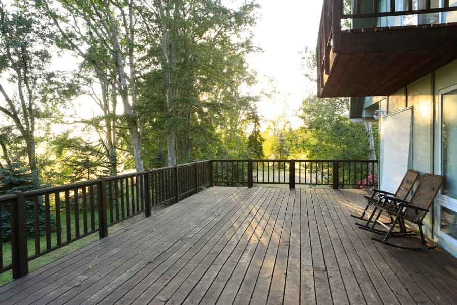 Deck with railing in backyard