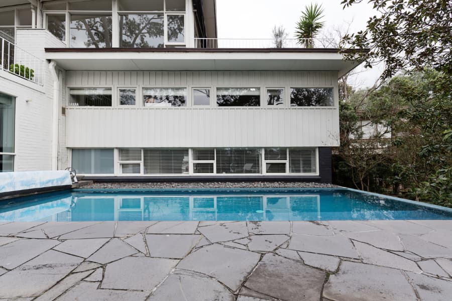 Home with in-ground swimming pool and paving