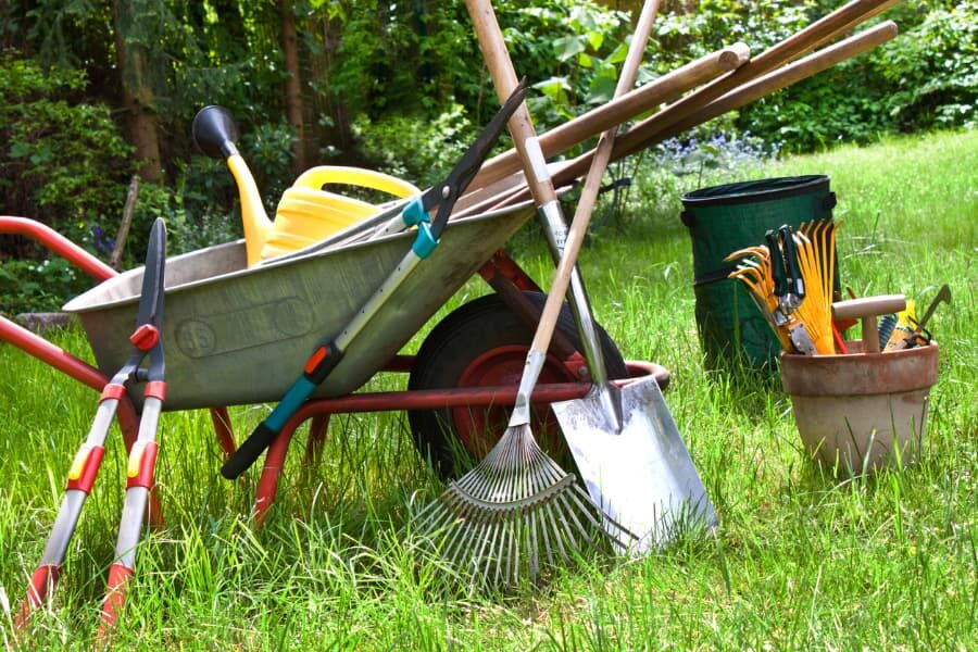 Wheelbarrow with various gardening tools